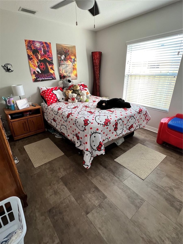 bedroom featuring visible vents and ceiling fan