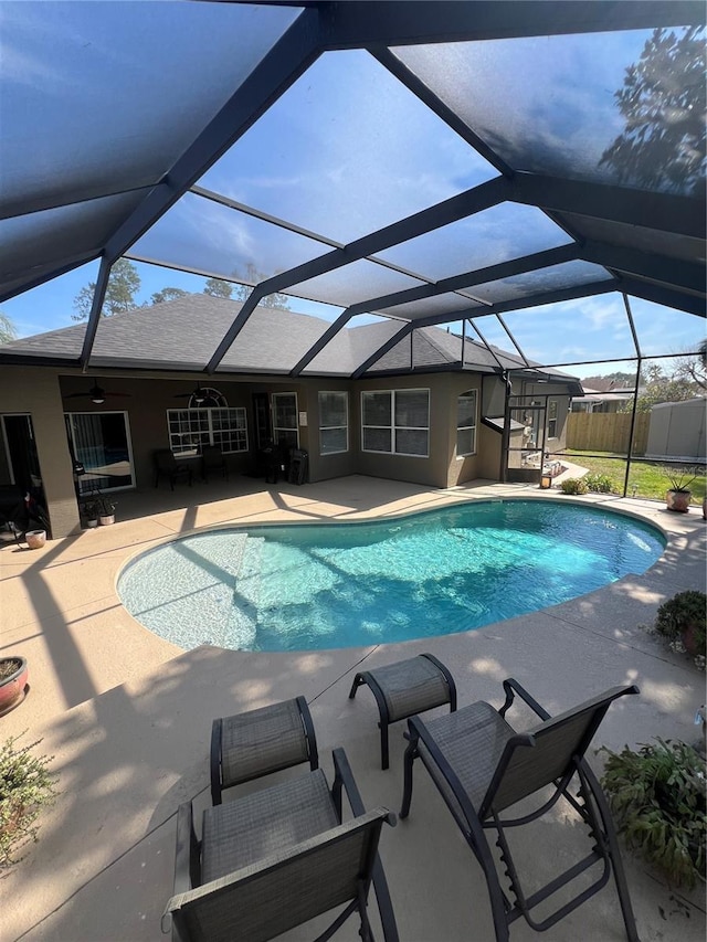 view of pool featuring a fenced in pool, a patio area, fence, and ceiling fan