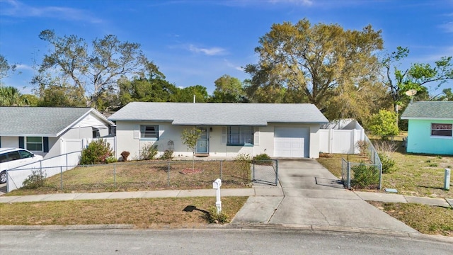 single story home with a fenced front yard, concrete driveway, stucco siding, a garage, and a gate