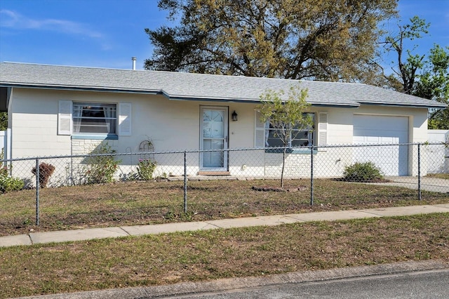 ranch-style house with a garage, roof with shingles, a fenced front yard, and concrete driveway