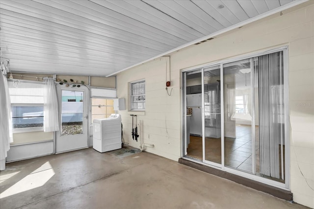 unfurnished sunroom with washer / clothes dryer