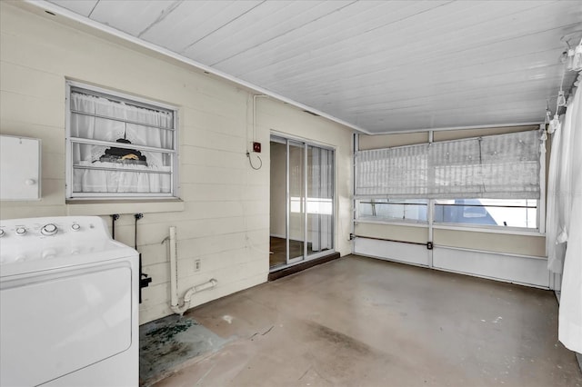 unfurnished sunroom featuring washer / dryer