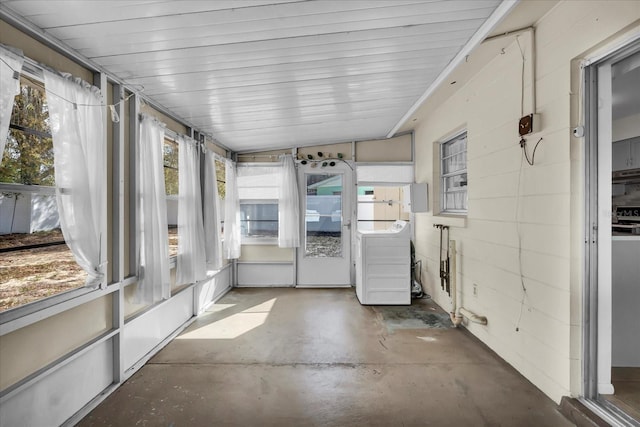 unfurnished sunroom with washer / clothes dryer