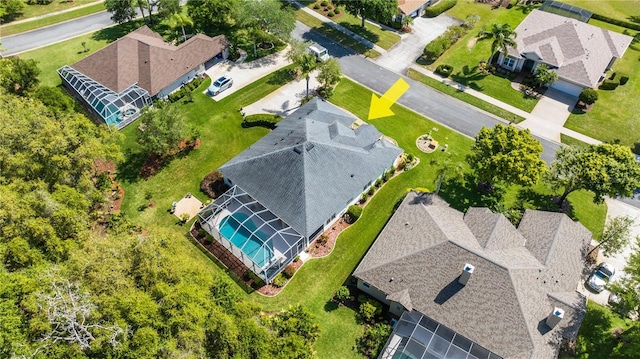 birds eye view of property with a residential view