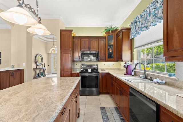 kitchen with crown molding, light stone countertops, tasteful backsplash, a sink, and appliances with stainless steel finishes