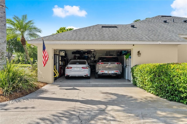 exterior space with concrete driveway