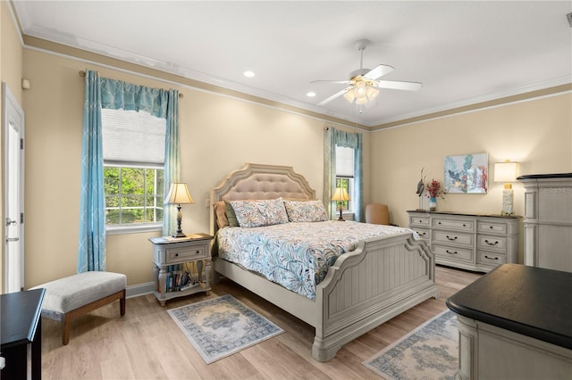 bedroom featuring ornamental molding, baseboards, ceiling fan, light wood-type flooring, and recessed lighting
