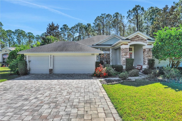 view of front of home with a garage, decorative driveway, stone siding, and stucco siding