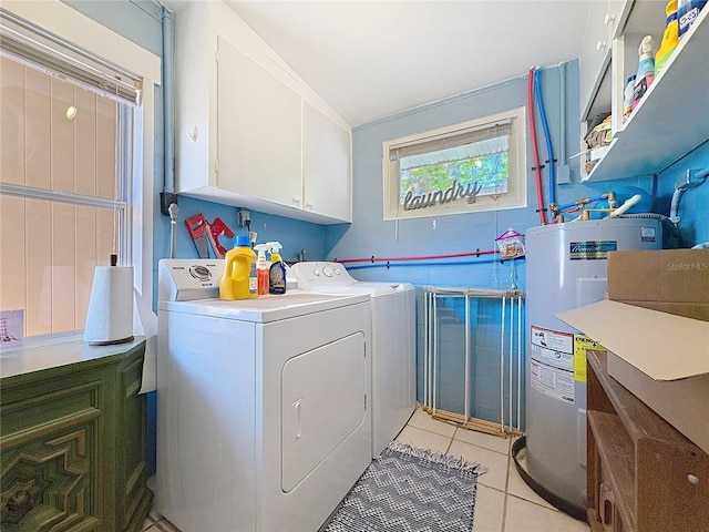 laundry area with washing machine and clothes dryer, light tile patterned floors, cabinet space, and water heater