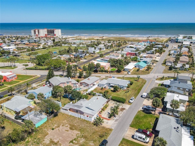 bird's eye view featuring a residential view and a water view