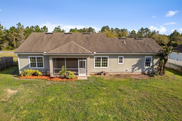 309 Crystal Lake Dr, Saint Augustine, FL 32084 - rear view of property with a lawn, fence, and a sunroom