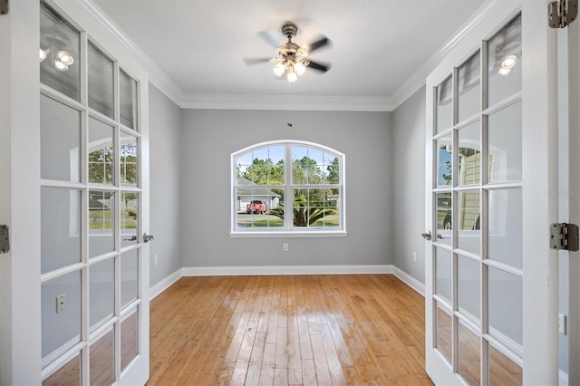 309 Crystal Lake Dr, Saint Augustine, FL 32084 - unfurnished room featuring a ceiling fan, hardwood / wood-style flooring, crown molding, and baseboards