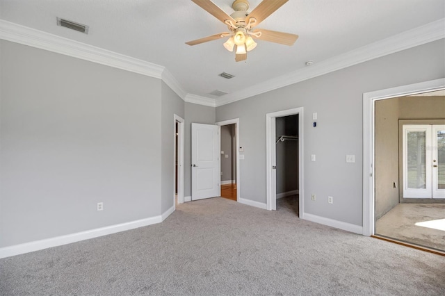309 Crystal Lake Dr, Saint Augustine, FL 32084 - unfurnished bedroom with a ceiling fan, baseboards, visible vents, carpet floors, and crown molding
