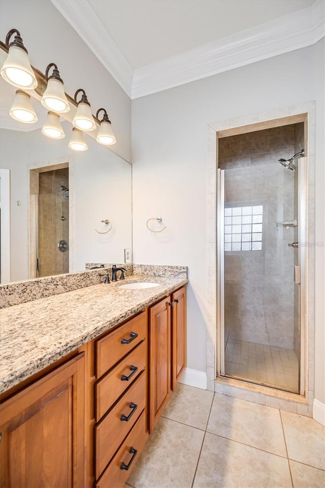 309 Crystal Lake Dr, Saint Augustine, FL 32084 - bathroom with tile patterned floors, a shower stall, crown molding, baseboards, and vanity