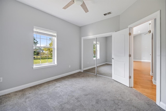 309 Crystal Lake Dr, Saint Augustine, FL 32084 - unfurnished bedroom featuring a ceiling fan, baseboards, visible vents, a closet, and carpet flooring