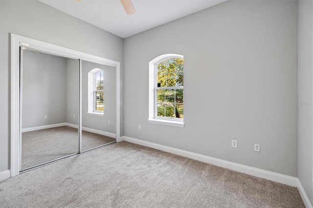 309 Crystal Lake Dr, Saint Augustine, FL 32084 - unfurnished bedroom with carpet flooring, baseboards, a closet, and ceiling fan