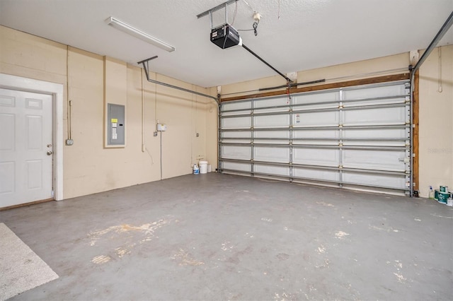 309 Crystal Lake Dr, Saint Augustine, FL 32084 - garage with electric panel and a garage door opener
