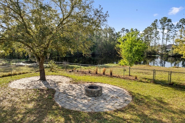 309 Crystal Lake Dr, Saint Augustine, FL 32084 - view of yard with a gate, a patio, an outdoor fire pit, and fence