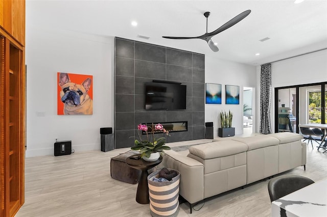 96 Del Palma Dr, Palm Coast, FL 32137 - living room with visible vents, baseboards, recessed lighting, a ceiling fan, and light wood-style floors