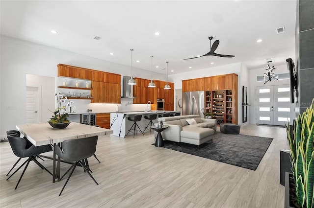 96 Del Palma Dr, Palm Coast, FL 32137 - interior space featuring wine cooler, light wood-style flooring, visible vents, ceiling fan, and recessed lighting
