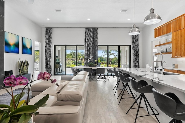 96 Del Palma Dr, Palm Coast, FL 32137 - living room featuring light wood-style flooring, a wealth of natural light, visible vents, and recessed lighting