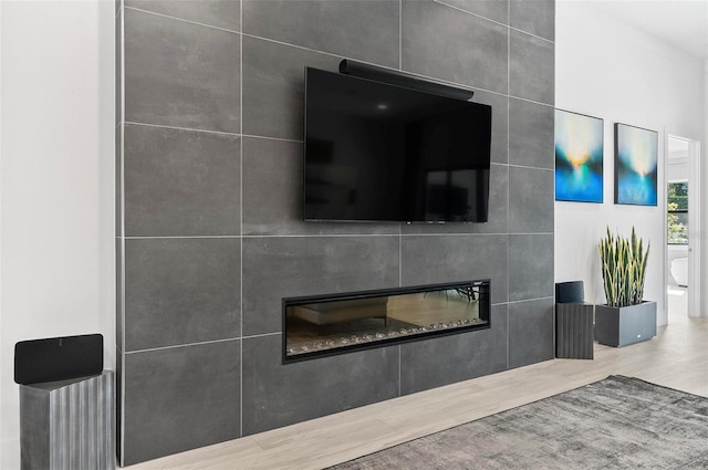 96 Del Palma Dr, Palm Coast, FL 32137 - details featuring a tiled fireplace and wood finished floors