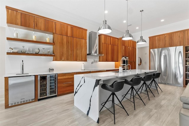 96 Del Palma Dr, Palm Coast, FL 32137 - kitchen with wine cooler, freestanding refrigerator, modern cabinets, fridge, and wall chimney range hood