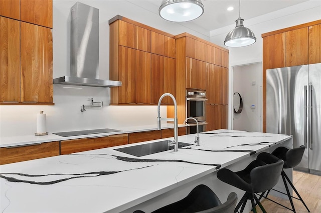 96 Del Palma Dr, Palm Coast, FL 32137 - kitchen featuring stainless steel appliances, wall chimney exhaust hood, and brown cabinets