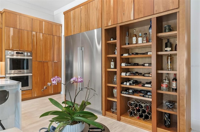 96 Del Palma Dr, Palm Coast, FL 32137 - wine room with light wood finished floors and ornamental molding