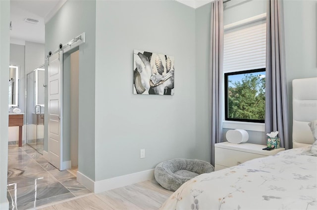 96 Del Palma Dr, Palm Coast, FL 32137 - bedroom with baseboards, a barn door, and visible vents
