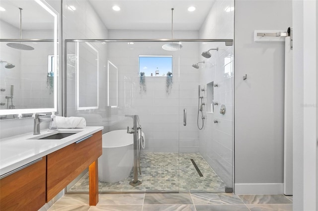 96 Del Palma Dr, Palm Coast, FL 32137 - full bathroom with vanity, a soaking tub, and a shower stall