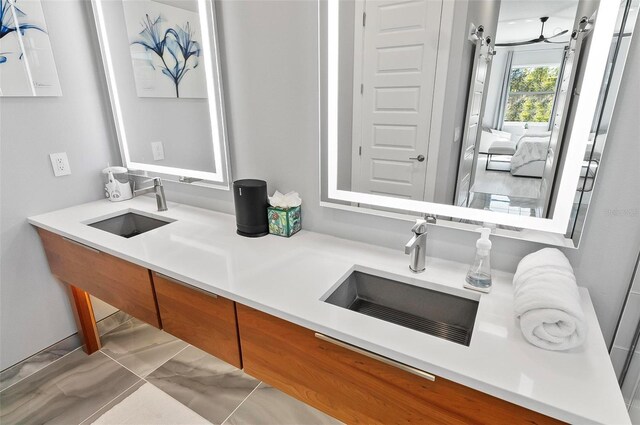 96 Del Palma Dr, Palm Coast, FL 32137 - bathroom with double vanity, connected bathroom, and a sink