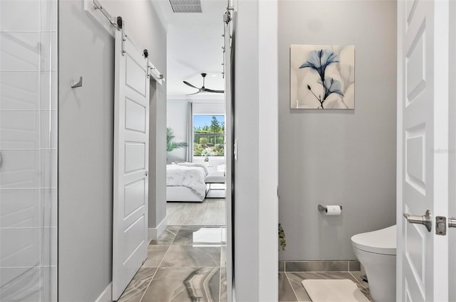 96 Del Palma Dr, Palm Coast, FL 32137 - bathroom with connected bathroom, baseboards, visible vents, and toilet