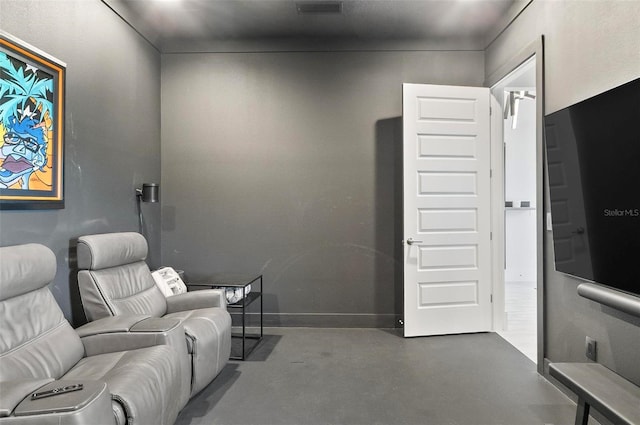 96 Del Palma Dr, Palm Coast, FL 32137 - home theater featuring baseboards and finished concrete floors