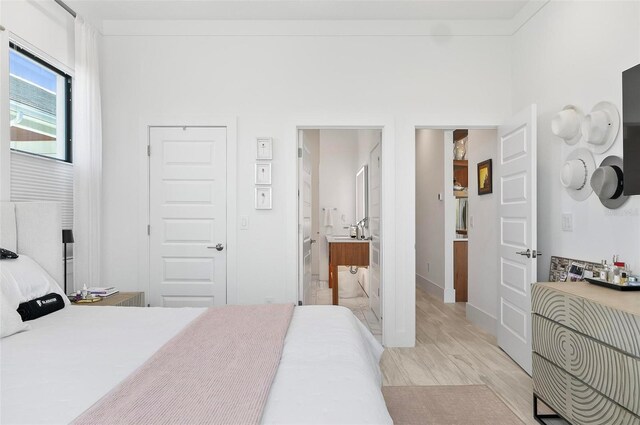 96 Del Palma Dr, Palm Coast, FL 32137 - bedroom featuring light wood-style flooring and ensuite bath