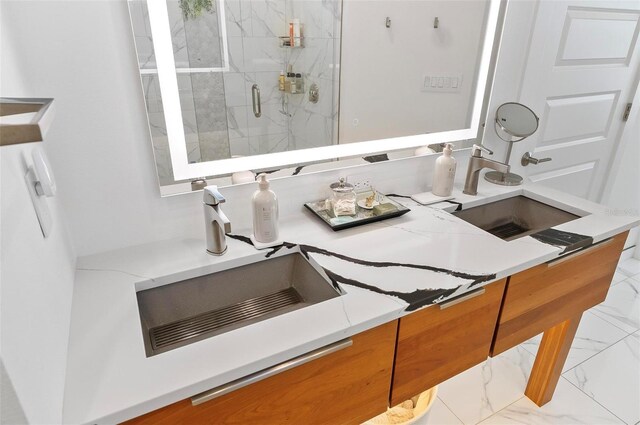 96 Del Palma Dr, Palm Coast, FL 32137 - full bathroom featuring marble finish floor, a sink, and a marble finish shower