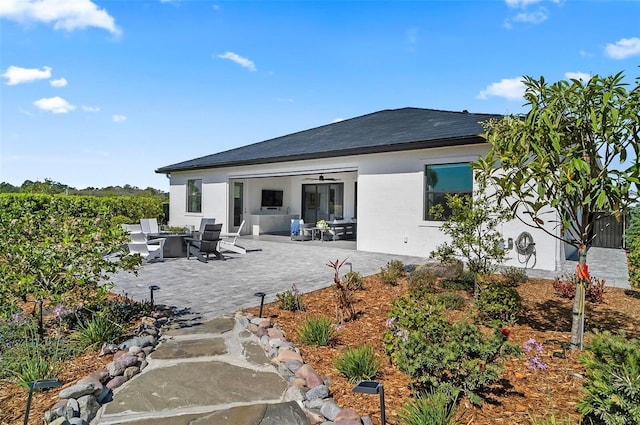 96 Del Palma Dr, Palm Coast, FL 32137 - rear view of property with a fire pit, stucco siding, and a patio