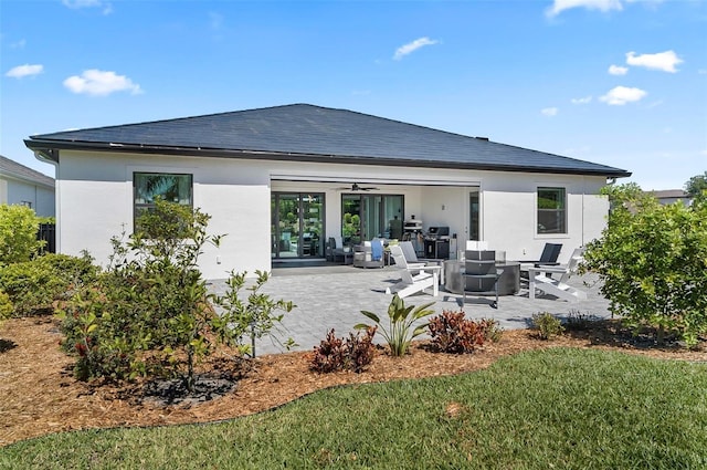 96 Del Palma Dr, Palm Coast, FL 32137 - rear view of property featuring a patio, a ceiling fan, and stucco siding