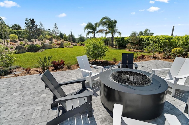96 Del Palma Dr, Palm Coast, FL 32137 - view of patio featuring a fire pit