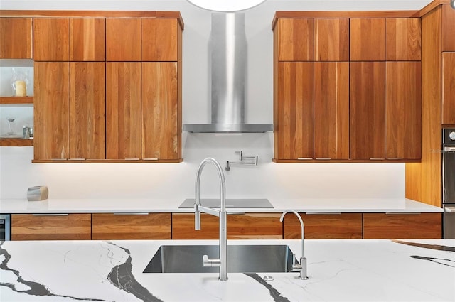 96 Del Palma Dr, Palm Coast, FL 32137 - kitchen featuring modern cabinets, brown cabinets, wall chimney range hood, and black electric stovetop