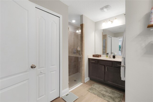 49 Narvarez Ave, Saint Augustine, FL 32084 - full bathroom featuring a stall shower, vanity, wood finished floors, a closet, and baseboards