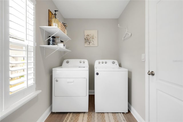 49 Narvarez Ave, Saint Augustine, FL 32084 - washroom with washer and dryer, wood finished floors, and baseboards