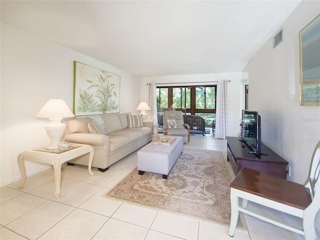 41 Oxford Ln Unit 41, Palm Coast, FL 32137 - living room with light tile patterned flooring and visible vents