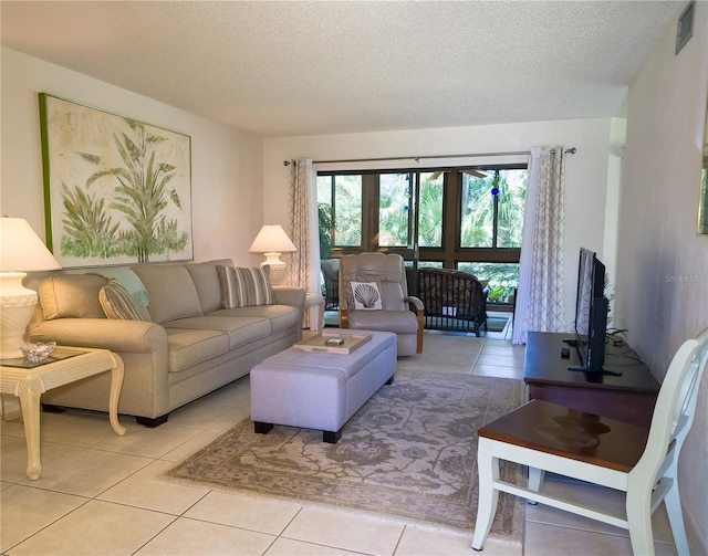 41 Oxford Ln Unit 41, Palm Coast, FL 32137 - living area with a textured ceiling, light tile patterned floors, and visible vents