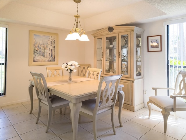 41 Oxford Ln Unit 41, Palm Coast, FL 32137 - dining room with light tile patterned floors and baseboards