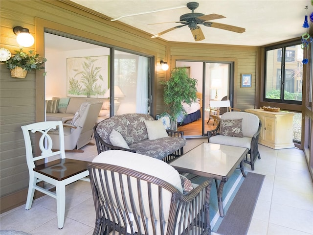 41 Oxford Ln Unit 41, Palm Coast, FL 32137 - sunroom / solarium with wooden walls, tile patterned floors, and a ceiling fan