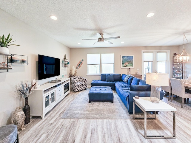 68 Los Lagos Blvd, Palm Coast, FL 32137 - living area featuring light wood-type flooring, a textured ceiling, healthy amount of natural light, ceiling fan, and recessed lighting