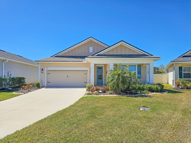 68 Los Lagos Blvd, Palm Coast, FL 32137 - view of front of home with board and batten siding, an attached garage, and concrete driveway
