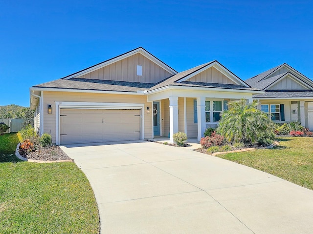 68 Los Lagos Blvd, Palm Coast, FL 32137 - view of front of property featuring a front yard, a garage, concrete driveway, board and batten siding, and a porch