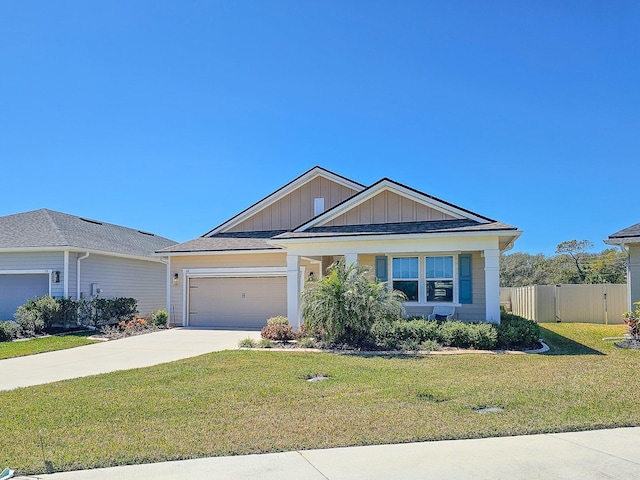 68 Los Lagos Blvd, Palm Coast, FL 32137 - view of front of house with board and batten siding, driveway, and a garage